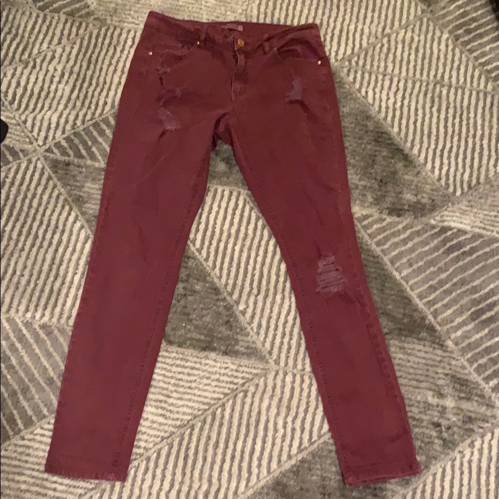 Red distressed jeans
